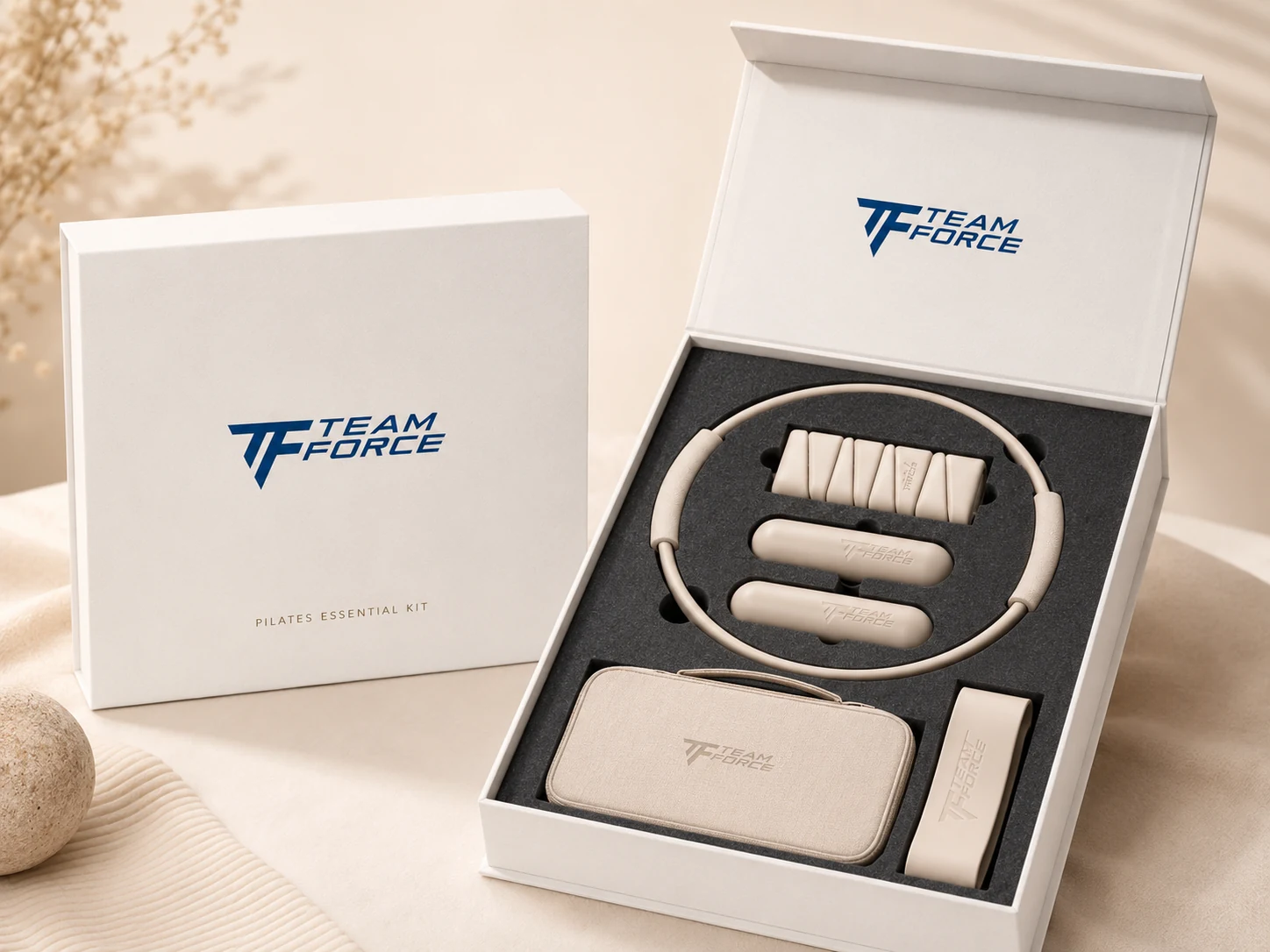 Premium Teamforce Pilates essential kit displayed in custom branded packaging with fitted inserts
